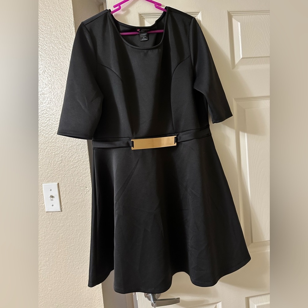 Women’s quarter length sleeve dress with a gold belt